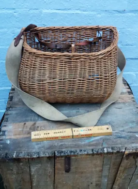 Beautiful rustic vintage wicker fisherman's basket with original strap and all its contents